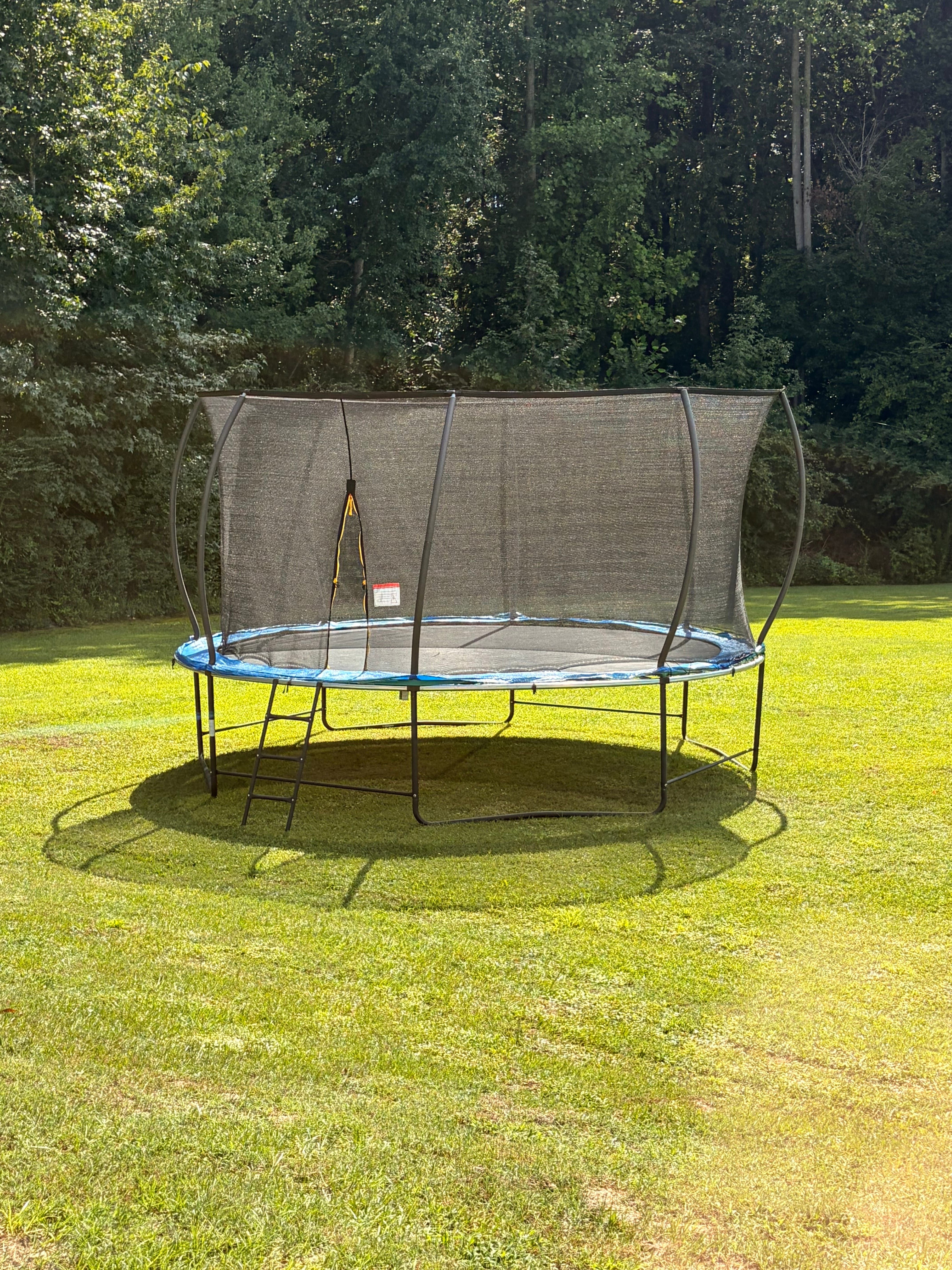 The outdoor trampoline beside the playground